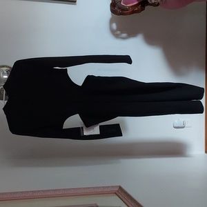 Black dress with long sleeves and hidden zipper in the back.